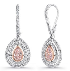A pair of platinum and rose gold drop earrings from Uneek feature a pear-cut pink diamond.