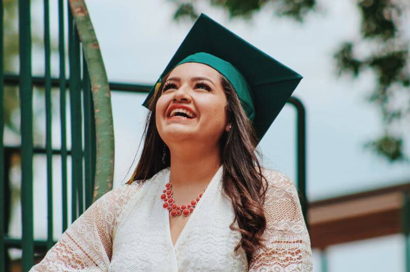 Happy Graduate in Green Cap