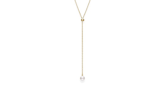 a yellow gold lariat necklace featuring a single pearl  and a gold sphere