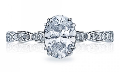 An oval-cut diamond engagement ring with pave side stones from TACORI.