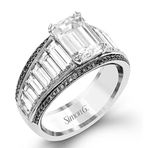 A emerald-cut diamond engagement ring with black diamond accents from Simon G.