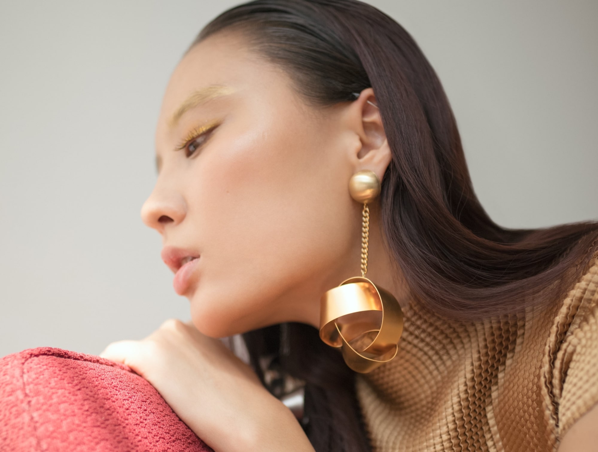 lady wearing large statement earrings