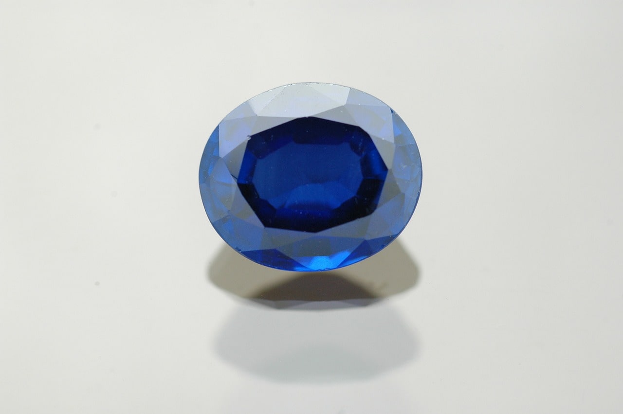 blue gemstone on a gray background