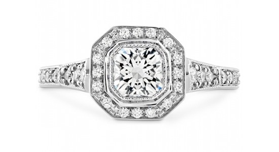 an art deco inspired engagement ring with a bezel setting