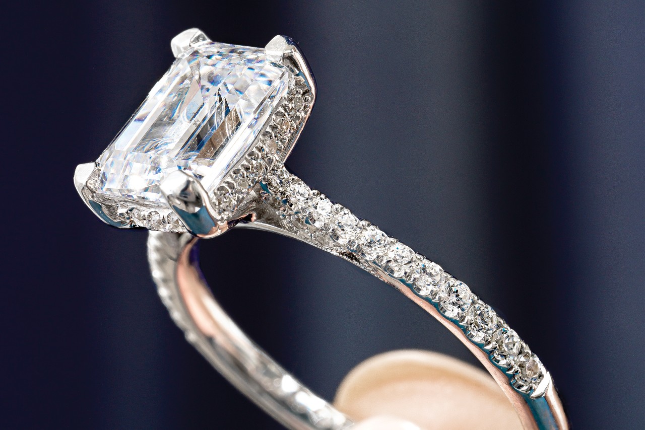 close up image of an emerald cut engagement ring by TACORI
