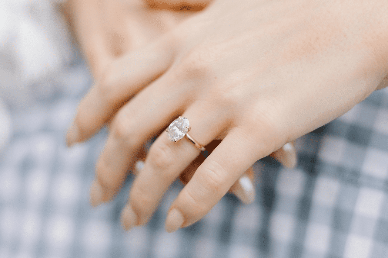 diamond engagement ring worn on a lady’s finger